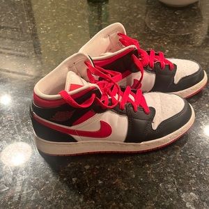 Red and black and white air jordan 1s